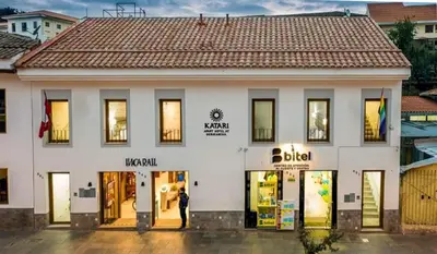 a man standing in front of a store at Katari Apart Hotel at Qorikancha in Cusco