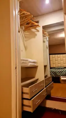 a room with a closet with drawers and a bed at Miraflores Dpto 2 dorm. espaciosos 4 huéspedes 90m2 in Lima