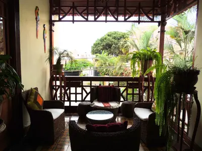 a room with chairs and tables and a large window at Lima Wari Hotel Boutique in Lima