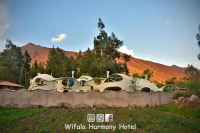 a house in the middle of a field at Wifala Harmony Hotel in Urubamba