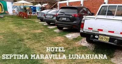 a row of parked cars parked in a yard at Hotel Septima Maravilla Lunahuana in Lunahuaná