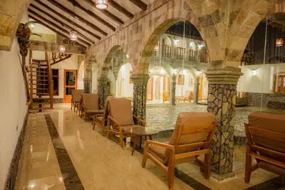 a hallway with chairs and tables in a building at Llamita Hotel-Huancayo in Huancayo