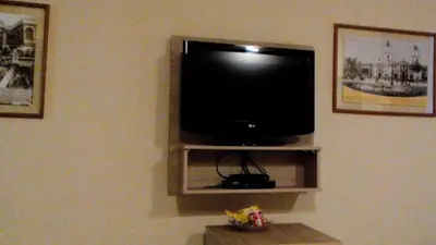 a flat screen tv sitting on a wall at Hotel Inka Path in Lima