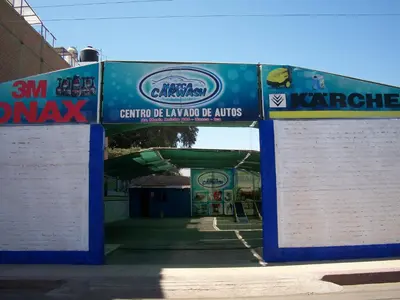 an entrance to a building with signs on it at Hostal Hellen Ross in Nazca