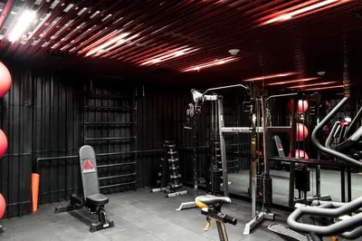 a gym with tread machines and equipment in a room at Radisson RED Miraflores in Lima