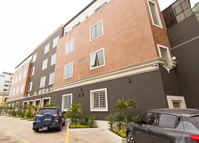 a black car parked in front of a building at Martinika in Lima