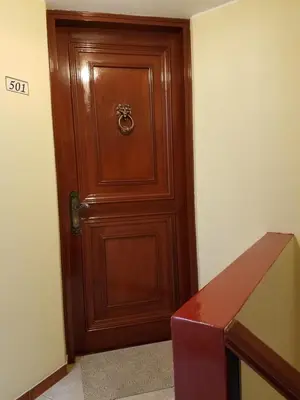 a wooden door in a room with a box at Entire Studio-Penthouse De Luxe in Lima