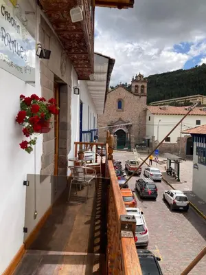 a balcony of a building with cars parked in a parking lot at Casona Corrales Hotel Boutique in Cusco