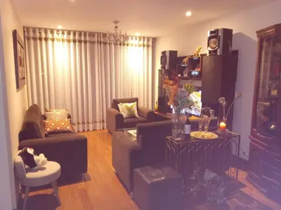 a living room with a couch and chairs and a table at Hope San Isidro in Lima