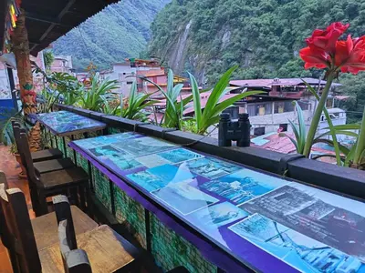 a table with a view of a mountain at Nativus Hostel Machu Picchu in Machu Picchu