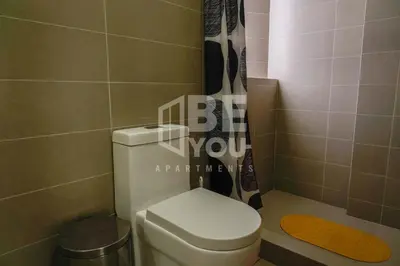 a bathroom with a toilet and a shower at Pet Friendly Apart-Maximo 9 Personas-Piscina-Parrilla-Billar-Gimnasio in Lima