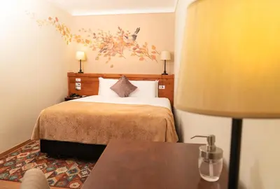 a hotel room with a bed and a table at Casa Biru Hotel Boutique in Cusco