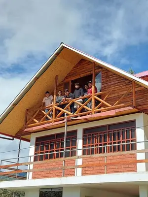 a group of people on the balcony of a house at Casa Hospedaje el Prado Eco turismo in Oxapampa
