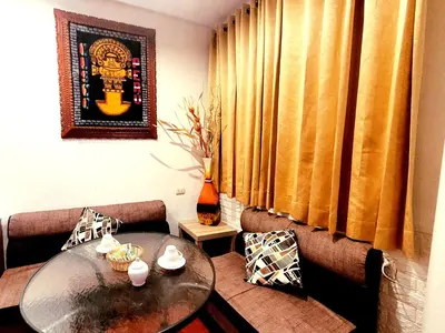 a living room with a table and a couch at wayra house san blas in Cusco