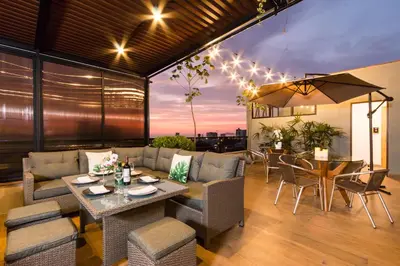a living room with a couch and a table at Surya Lima in Lima