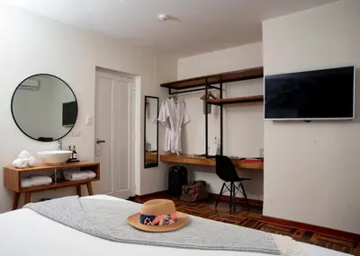 a bedroom with a hat on top of a bed at Lima 18 Boutique in Lima