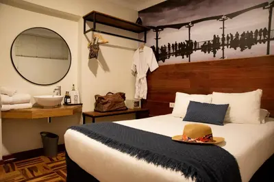 a bedroom with a bed with a hat on it at Lima 18 Boutique in Lima