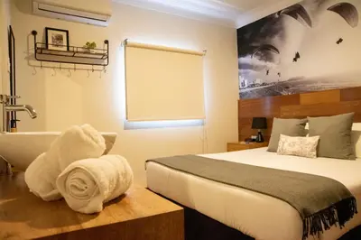 a hotel room with a bed and a bath tub at Lima 18 Boutique in Lima