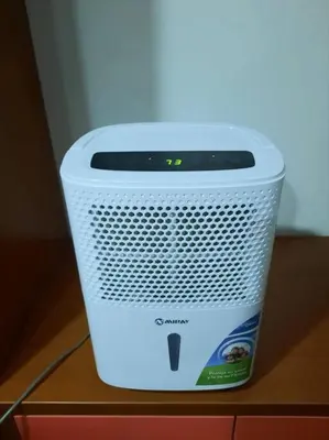 a cooler is sitting on top of a table at Británico en Miraflores & primer piso, 3 dormitorios in Lima