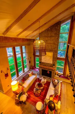 a living room with a couch and a fireplace at NUNA by DCO in Urubamba