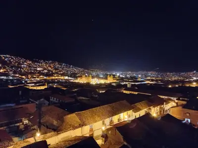 a view of a city at night at Marvelous Plaza in Cusco