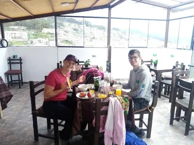 a man and a woman sitting at a table at Marvelous Plaza in Cusco