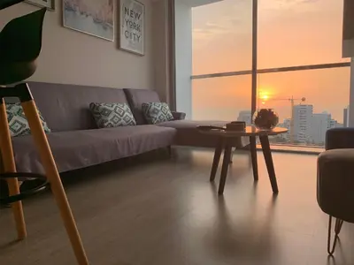 a living room with a couch and a table at Connect in Lima