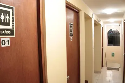 a hallway with a door with a sign on it at Peruvian Wasi - Bed & Breakfast in Lima
