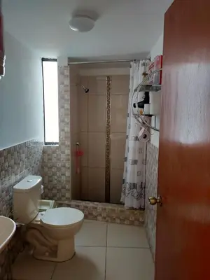 a bathroom with a toilet and a shower at CASA BONITA in Lima