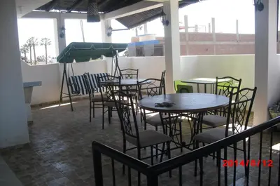 a group of tables and chairs in a restaurant at Hostal Boulevard in Nazca