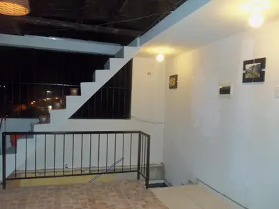 a staircase in a building with a stair case at Hostal Boulevard in Nazca