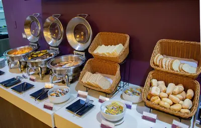 a buffet with baskets of food on a table at Aku Hotels in Lima