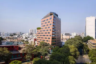 a tall building in the middle of a city at Fairfield by Marriott Lima Miraflores in Lima