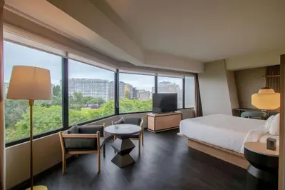 a hotel room with a bed and a large window at Fairfield by Marriott Lima Miraflores in Lima