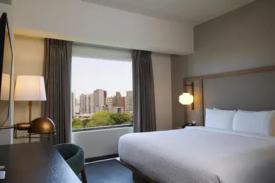 a hotel room with a bed and a large window at Fairfield by Marriott Lima Miraflores in Lima