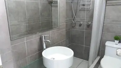 a bathroom with a toilet and a shower at El Refugio in Punta Hermosa