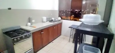 a kitchen with a counter with a cake on it at Arena Costa Lima private rooms Peru in Lima