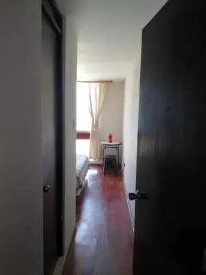 a room with a bedroom with a bed and a window at Arena Costa Lima private rooms Peru in Lima