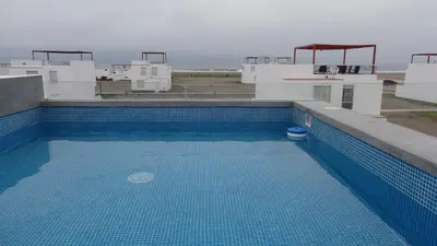 a swimming pool on the roof of a building at Donde Lalo in Asia