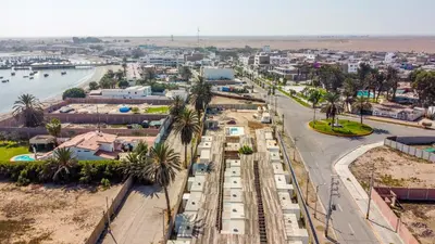 an aerial view of a city with a train at Casa Caravanas in Paracas