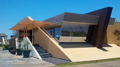 a house with a staircase leading up to it at Aranwa Paracas Resort & Spa in Paracas