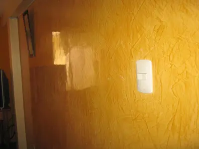 a wall with a white lightswitch on a yellow wall at Hospedaje Pumacurco Betty in Cusco