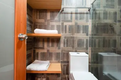 a bathroom with a toilet and a shower at luxury Andino Ciudad real & 1 bed in Lima