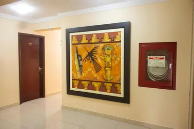 a painting on a wall in a hallway at Royal Garden Hotel in Lima