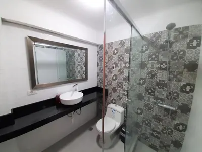 a bathroom with a toilet and a sink and a shower at Miraflores Kennedy's Park Apartment in Lima