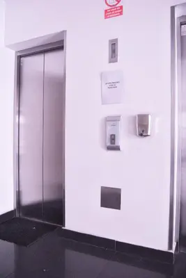a elevator with a glass door in a building at KYRA APARTMENTS - Central Miraflores - Spacious 4BR for 07 guests in Lima