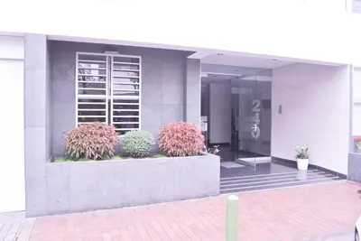a building with plants on the side of it at KYRA APARTMENTS - Central Miraflores - Spacious 4BR for 07 guests in Lima