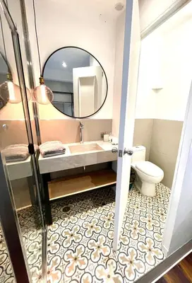 a bathroom with a sink and a mirror at Casa Montes San Blas in Cusco