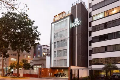 a building with a sign on the side of it at Equo Hotel Boutique in Lima