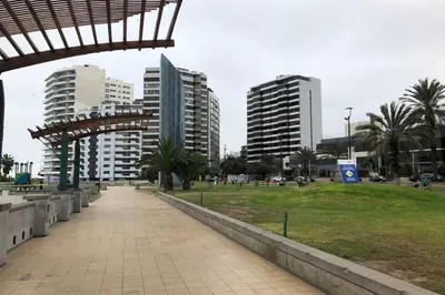 a park with tall buildings in a city at (5)Modern Miraflores tourist area apartment in Lima